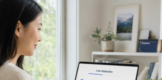 Loan Application Process Explained: From Prequalification to Funding Woman reviewing the loan application process on a laptop